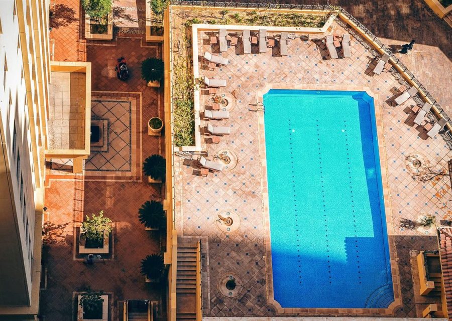 A courtyard water feature seen from above, set into paving.