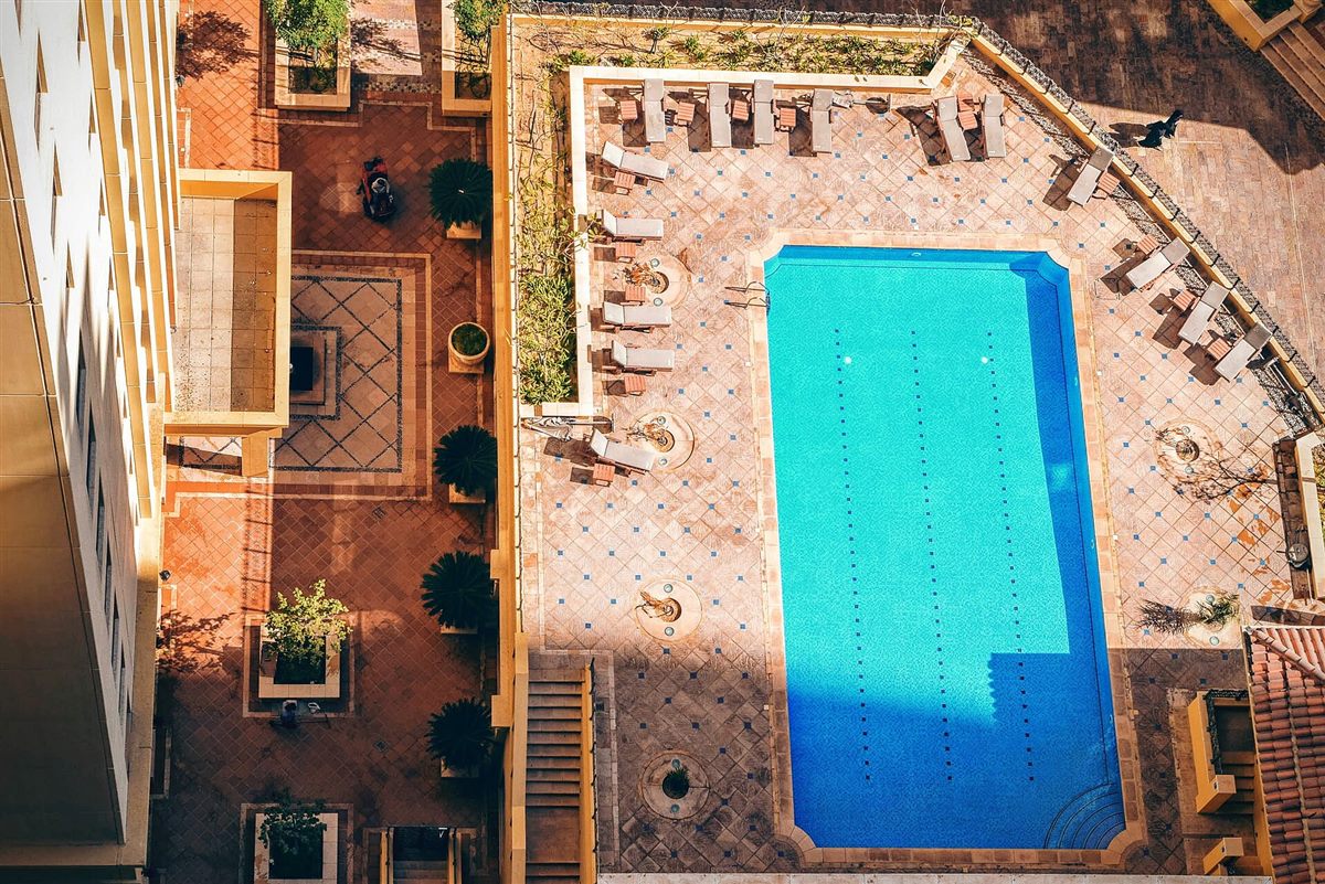 A courtyard water feature seen from above, set into paving.