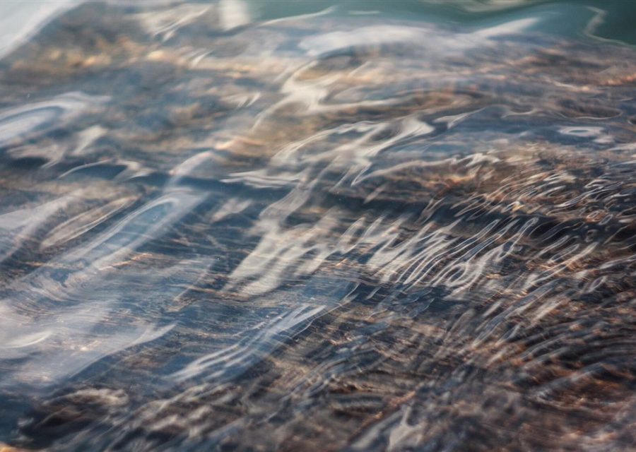 A continuous sheet of moving water seen close to.